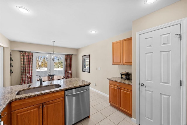 kitchen featuring an inviting chandelier, dishwasher, hanging light fixtures, light stone counters, and sink