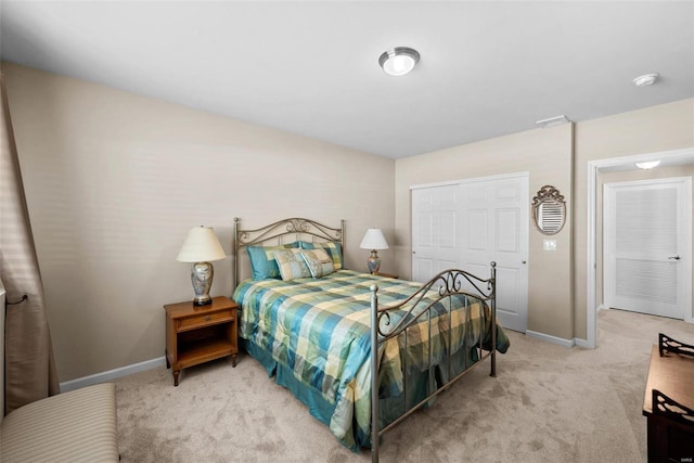 carpeted bedroom with a closet