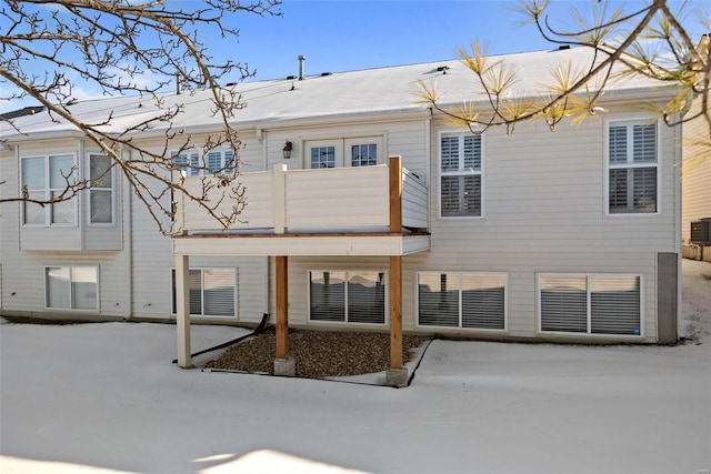 rear view of property with a balcony and cooling unit