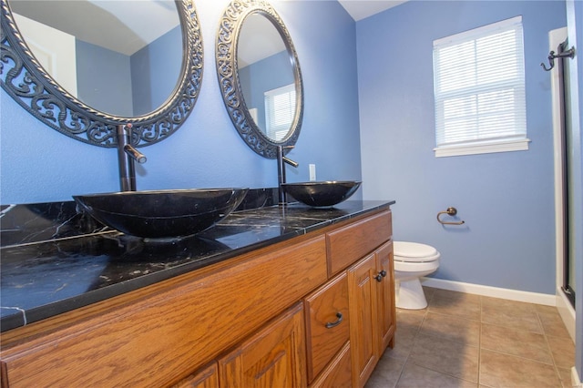 bathroom with tile patterned floors, toilet, and vanity