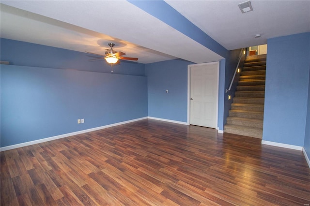 unfurnished living room featuring dark hardwood / wood-style floors and ceiling fan