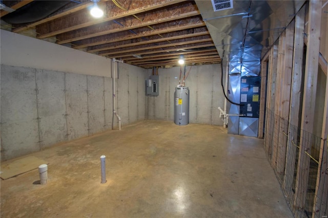 basement featuring electric water heater and electric panel