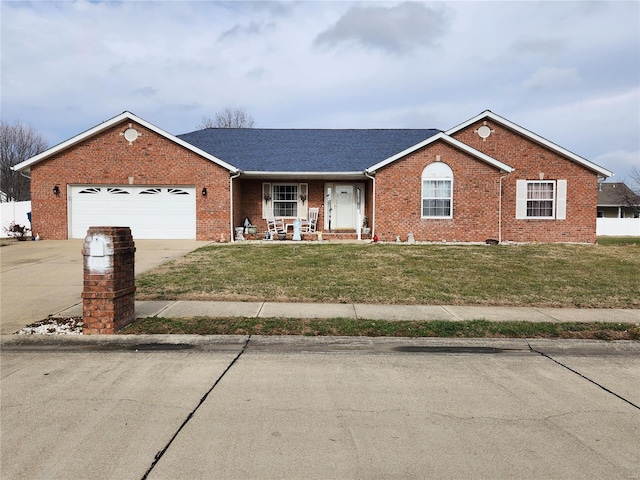 ranch-style house featuring a garage and a front yard