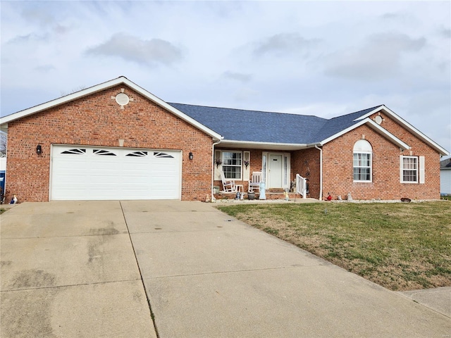 single story home with a front yard and a garage