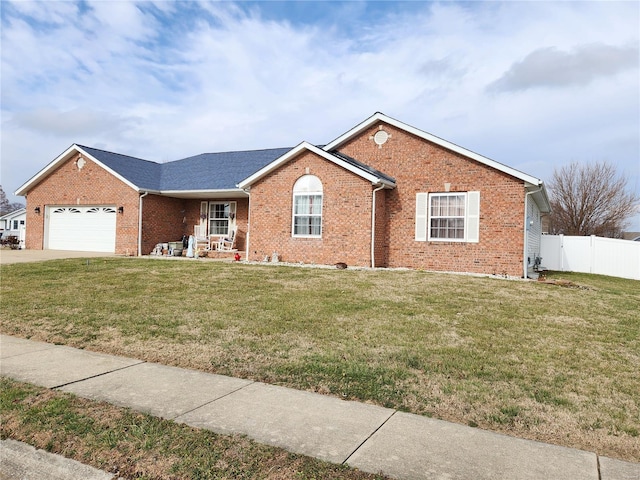 single story home featuring a front lawn and a garage