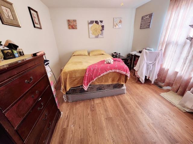 bedroom featuring light wood-type flooring