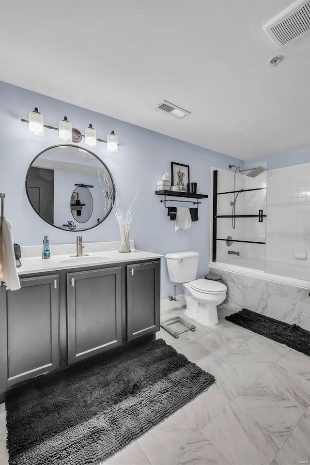 bathroom with tiled shower / bath combo and vanity