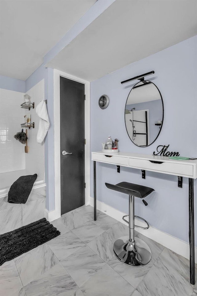 bathroom with a tile shower