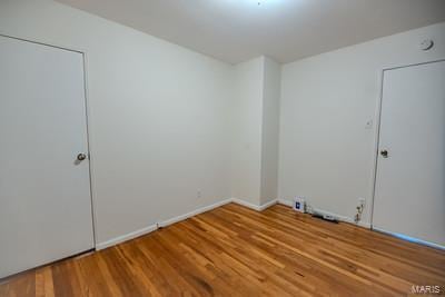 empty room featuring hardwood / wood-style flooring