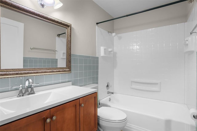 full bathroom featuring tasteful backsplash, vanity,  shower combination, tile walls, and toilet