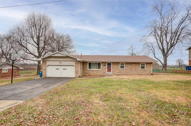 single story home with a garage and a front lawn