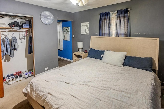 carpeted bedroom with a closet