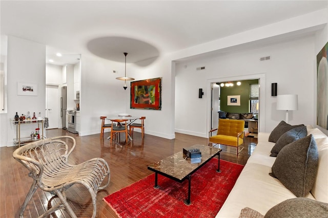 living room featuring dark hardwood / wood-style flooring