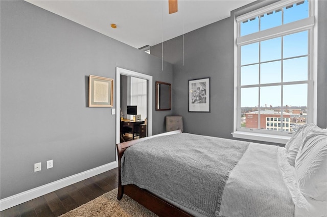 bedroom featuring hardwood / wood-style flooring and ceiling fan