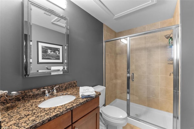 bathroom with vanity, toilet, and a shower with shower door