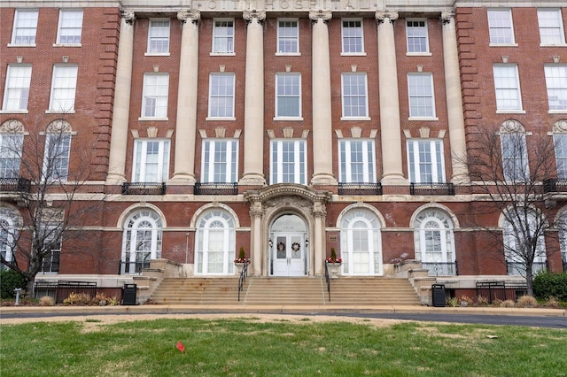 view of building exterior with central AC unit