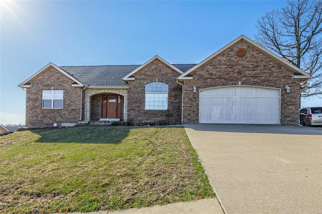 view of front of house with a garage and a front lawn