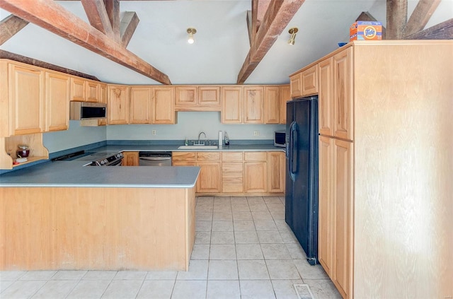 kitchen with sink, light tile patterned floors, light brown cabinetry, appliances with stainless steel finishes, and beamed ceiling