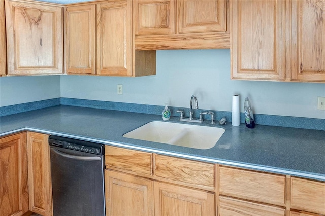 kitchen featuring stainless steel dishwasher, light brown cabinets, and sink