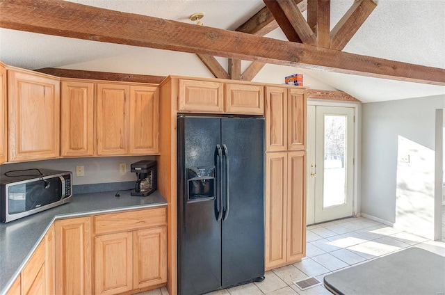 kitchen with black refrigerator with ice dispenser, light brown cabinetry, light tile patterned floors, and lofted ceiling with beams