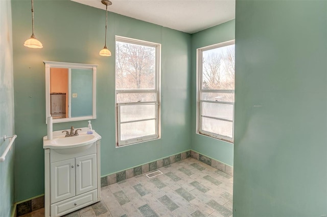 bathroom with a wealth of natural light and vanity