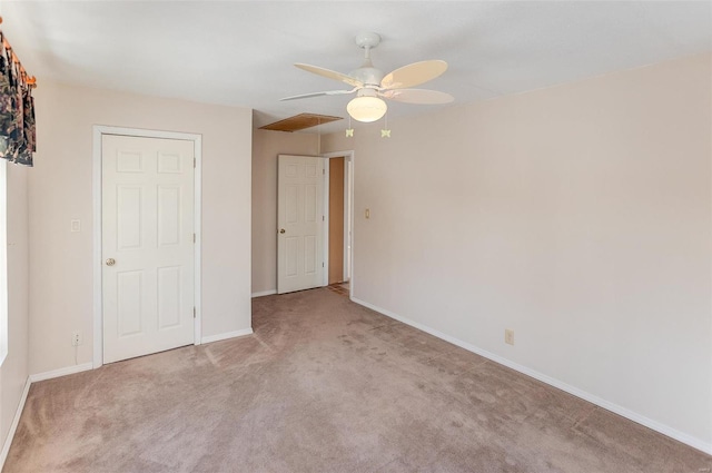 unfurnished bedroom with ceiling fan and light colored carpet