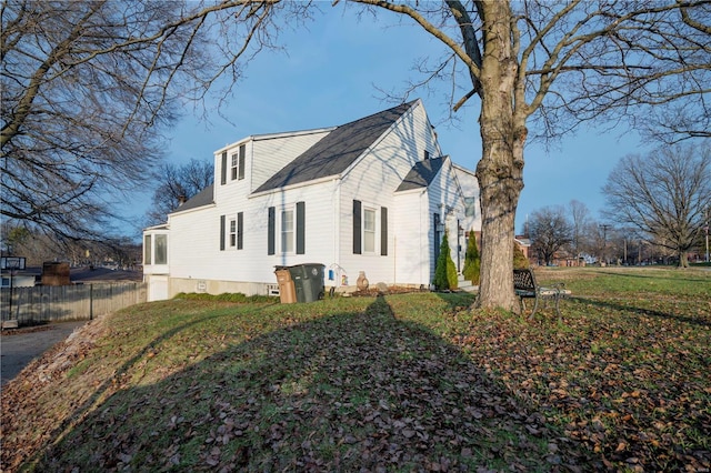 view of property exterior with fence