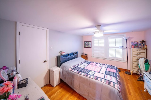 bedroom featuring light wood-style flooring and ceiling fan