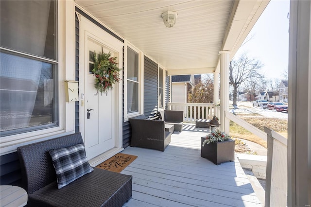 wooden terrace with a porch