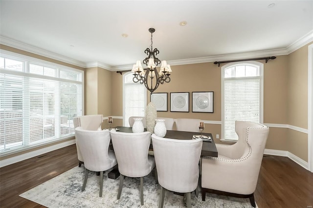 dining space with baseboards, an inviting chandelier, dark wood finished floors, and crown molding