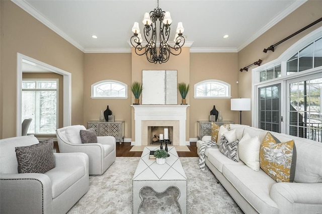 living room featuring light wood-style floors, a fireplace with flush hearth, ornamental molding, and recessed lighting