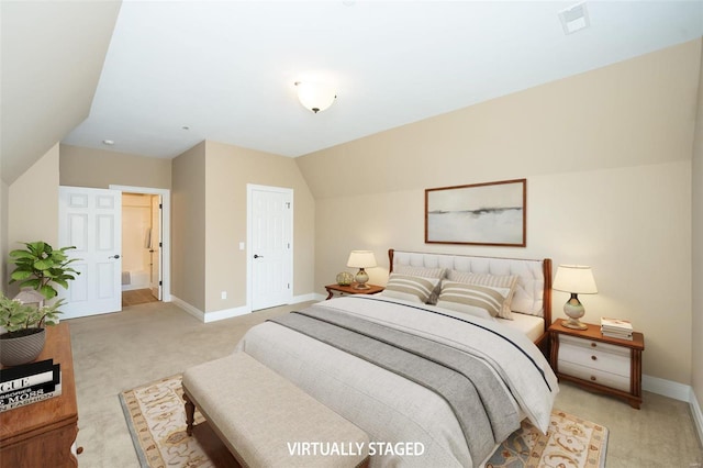 bedroom with light carpet, vaulted ceiling, visible vents, and baseboards