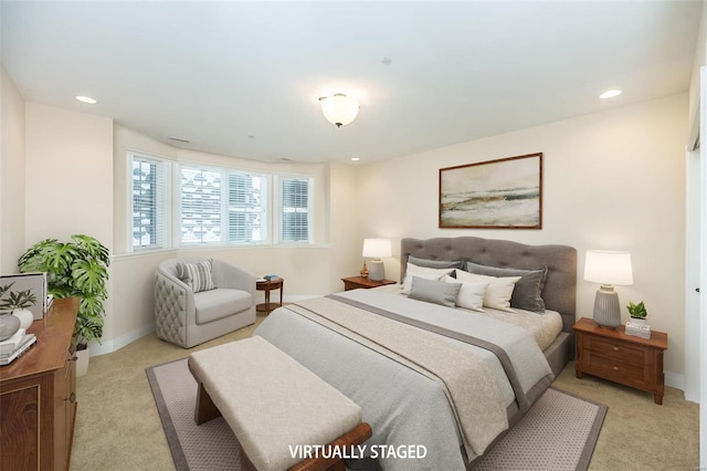 bedroom featuring recessed lighting, baseboards, and light colored carpet