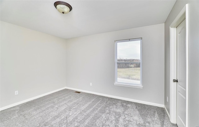 empty room featuring carpet floors