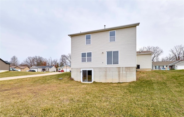 back of property featuring a yard