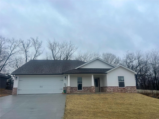 view of front facade with a front yard and a garage