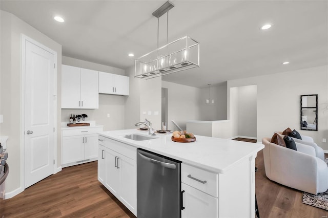 kitchen featuring white cabinetry, a center island with sink, stainless steel dishwasher, and decorative light fixtures