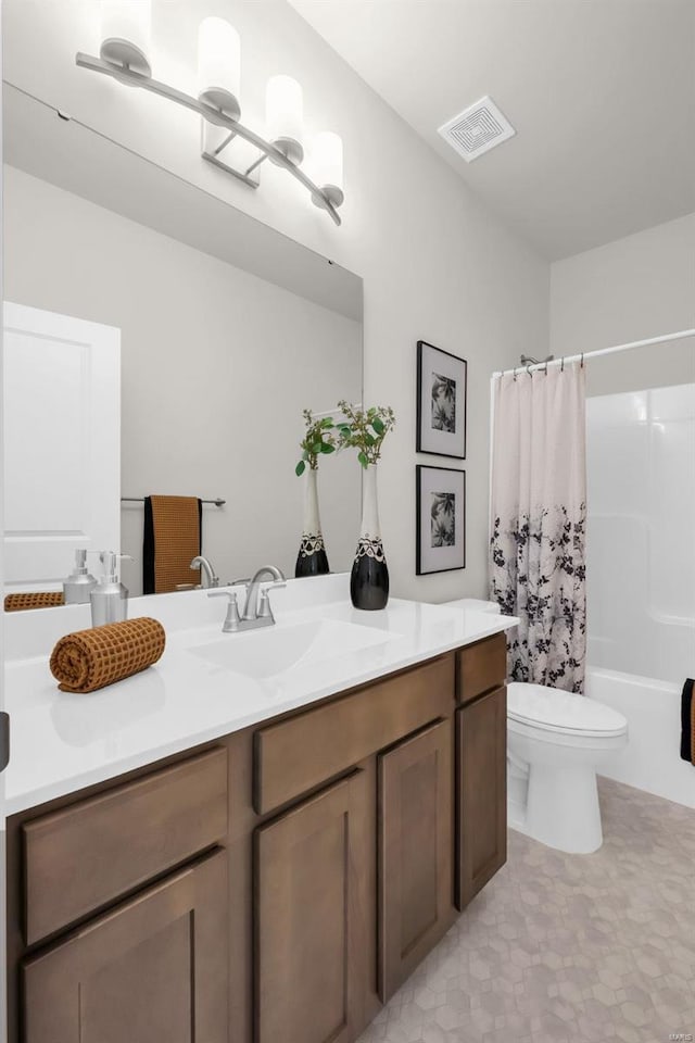 full bathroom featuring vanity, toilet, and shower / tub combo with curtain