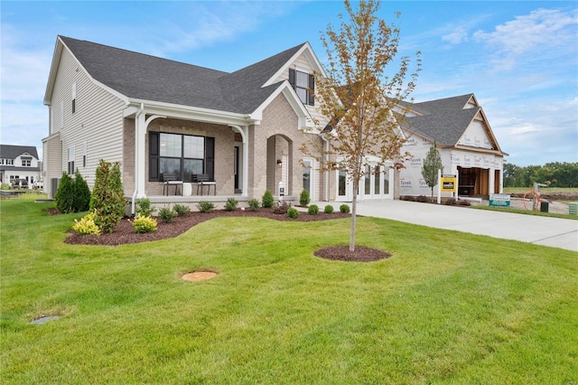 view of front of home featuring a front yard and a garage