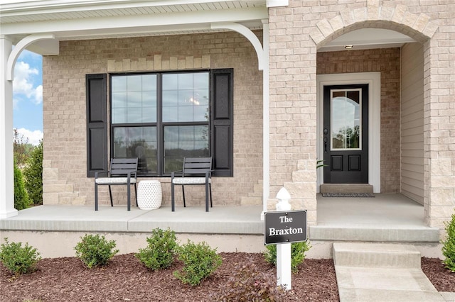 doorway to property with covered porch