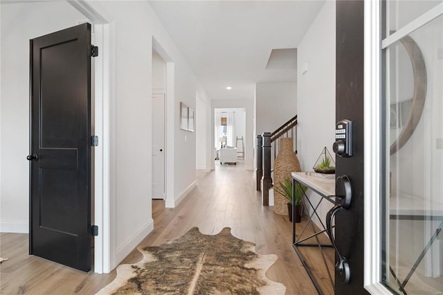 entryway with light hardwood / wood-style floors