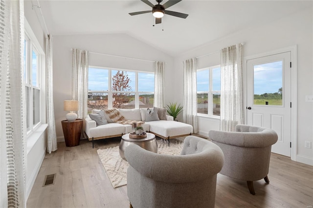 sunroom / solarium featuring ceiling fan and vaulted ceiling