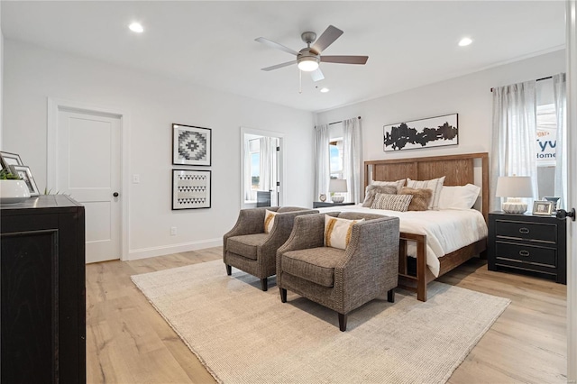 bedroom featuring light hardwood / wood-style flooring and ceiling fan