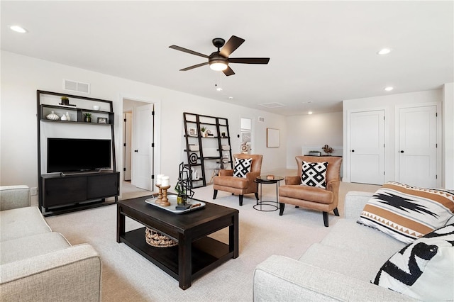 living room featuring ceiling fan and light carpet