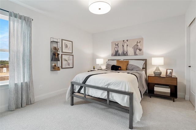 bedroom with light carpet