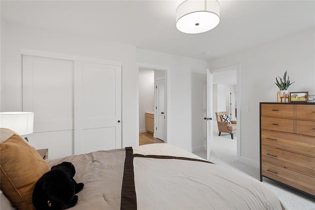 carpeted bedroom with a closet