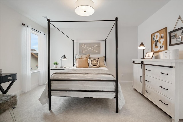 bedroom featuring light carpet