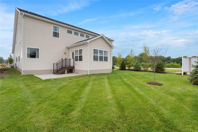 back of house featuring a lawn