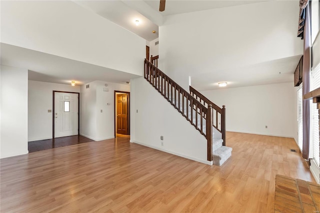 unfurnished living room featuring light wood-type flooring