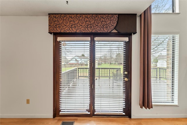 doorway with light hardwood / wood-style floors